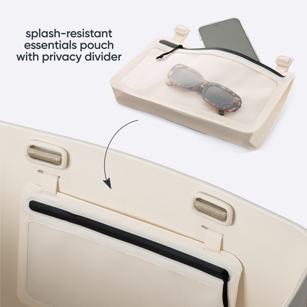Owala Sun-Day Collapsible Tote in Checkin' In showing the splash-resistant essentials pouch detached above with a phone and tortoiseshell sunglasses inside, and an arrow pointing to where it attaches on the cream tote, with text overlay reading "splash-resistant essentials pouch with hidden pocket"